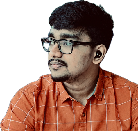 Chiranjeevi B S wearing an orange shirt and glasses
